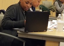 Conference attendee on a laptop