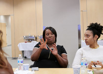 Two women speaking to each other