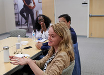 Conference attendees talking around a table