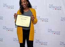 Solo Noir with a Certificate of Completion in front of a "The Workshop at Macy's" backdrop