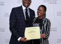 Tayion Collections with a Certificate of Completion in front of a "The Workshop at Macy's" backdrop