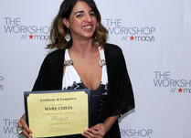 Mare Cheia with a Certificate of Completion in front of a "The Workshop at Macy's" backdrop