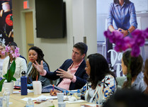 Conference attendees talking around a table