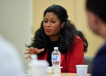 A woman addressing other attendees