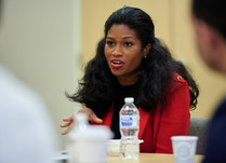 A woman addressing other attendees