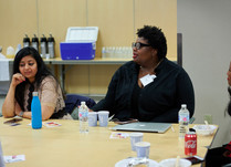 A woman addressing other attendees