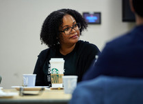 A woman listening to what is being discussed