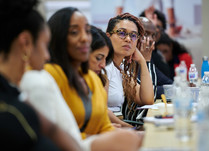 Row of attendees listening to what is being discussed