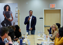 A man addresses conference attendees
