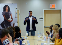 A man addresses conference attendees