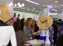 Woman looking at clothing on a rack