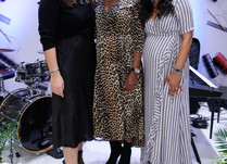 Three women posing for a photo