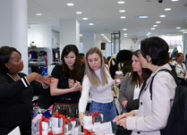 Product representatives talking with interested attendees