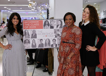 Three women posing by Class of 2019 sign