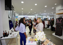 Product representatives talking with interested attendees