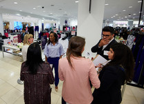 Product representatives talking with interested attendees