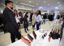 Product representatives talking with interested attendees