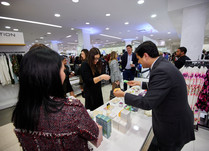 Product representatives talking with interested attendees