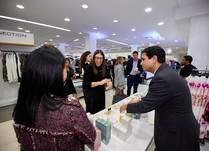Product representatives talking with interested attendees