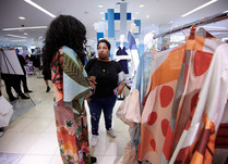 Product representatives talking with interested attendee