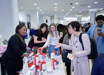 Product representatives talking with interested attendees