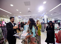 Product representatives talking with interested attendee