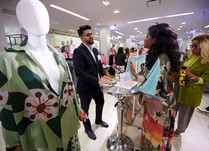 Product representatives talking with interested attendee