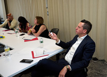 Conference attendees sitting around a table