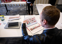Man looking at a catalog of holiday/seasonal items