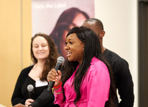 Woman speaking into a microphone