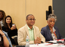 Workshop attendees engaged in conversation 