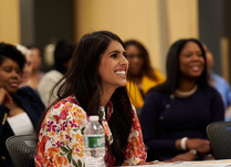 Workshop attendees engaged in conversation 