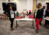 Black Paper Party attendees with their Christmas products