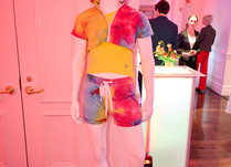 Mannequin wearing matching tie-dye short and crop jacket with yellow tshirt