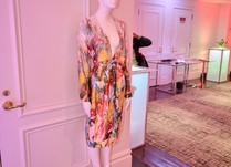 Mannequin with a printed low v-neck long-sleeved dress