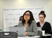 A woman listening to what is being discussed
