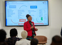 A woman presents to workshop attendees