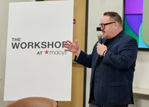 A man presents to workshop attendees