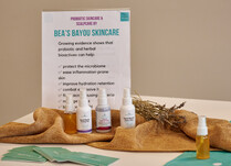 Bea's Bayou Skincare Products sign with benefits and products including toning mist, face solution and glow mist