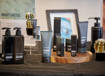 Close up of Cardon skin care products including shampoo, conditioner and shaving cream