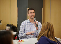 A workshop attendee addresses other attendees