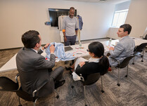 Workshop attendee talks clothing with panel