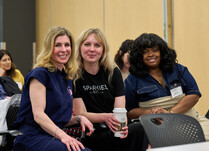 A group of three woman posing for a photo