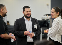 A group of attendees talking with each other
