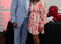 A man and a woman smiling for a photo