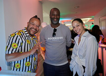 Three people smiling for a photo