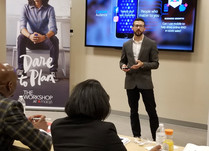 Man presenting to conference attendees 