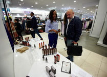Product representatives talking with interested attendee
